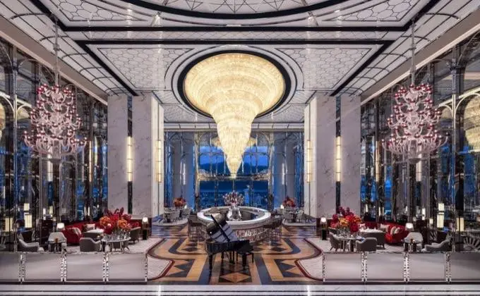 Raffles Lounge & Terrace, set inside an iconic jewellery box like structure is a modern interpretation of old grandeur, with a beautiful champagne, caviar and oyster bar set beneath another enormous jaw-dropping chandelier.